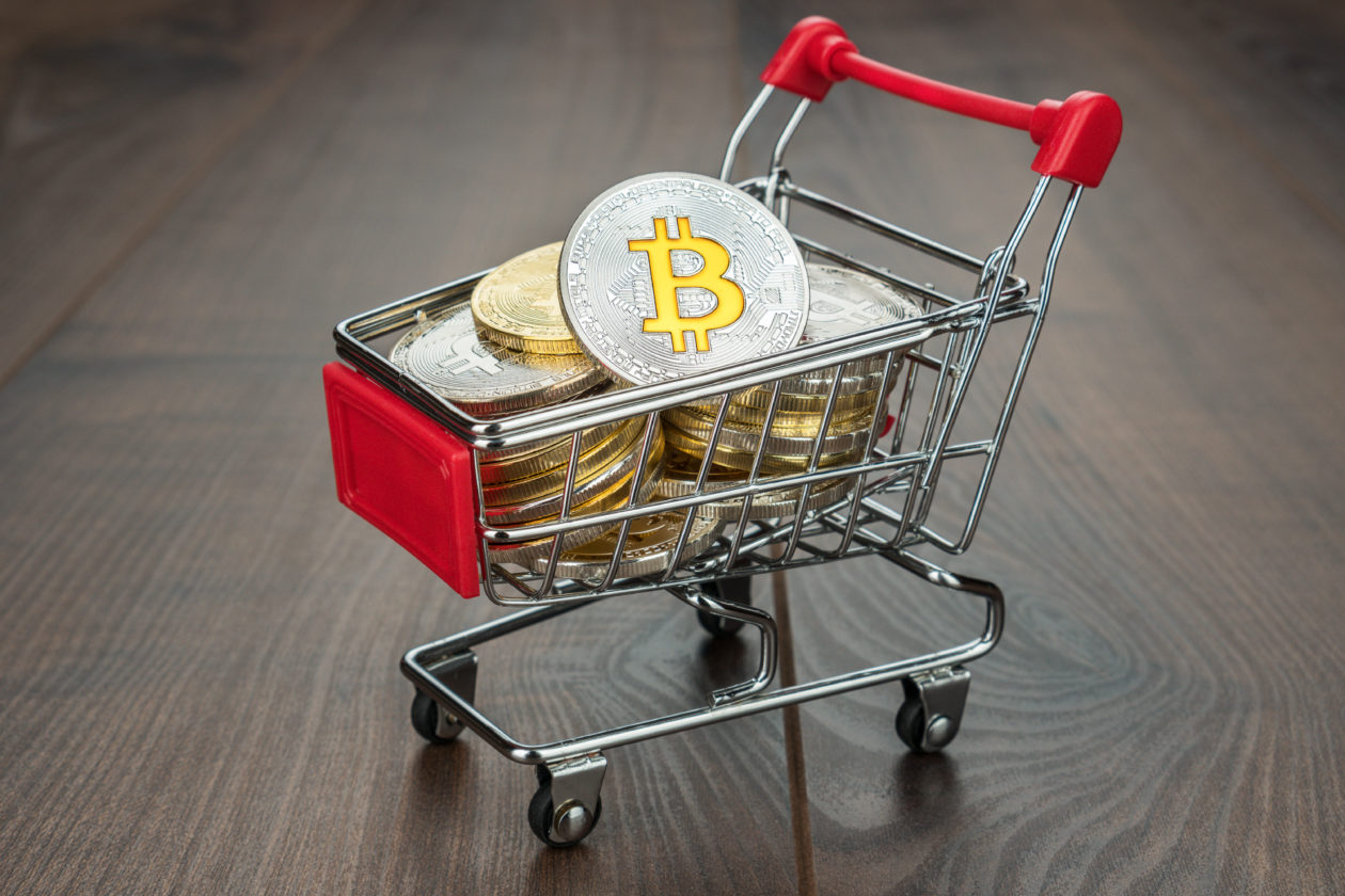 shopping trolley full of bitcoin currency concept on the wooden background, Jack Mallers’ Strike to bring Bitcoin shopping to Shopify